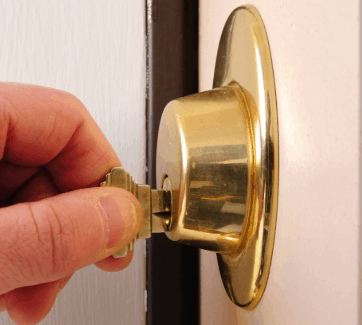a key inside the cylinder gold lock