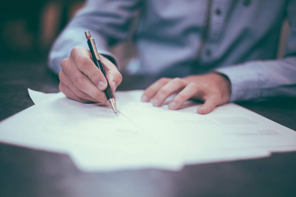 man writing the terms of service for the company Houston key locksmith