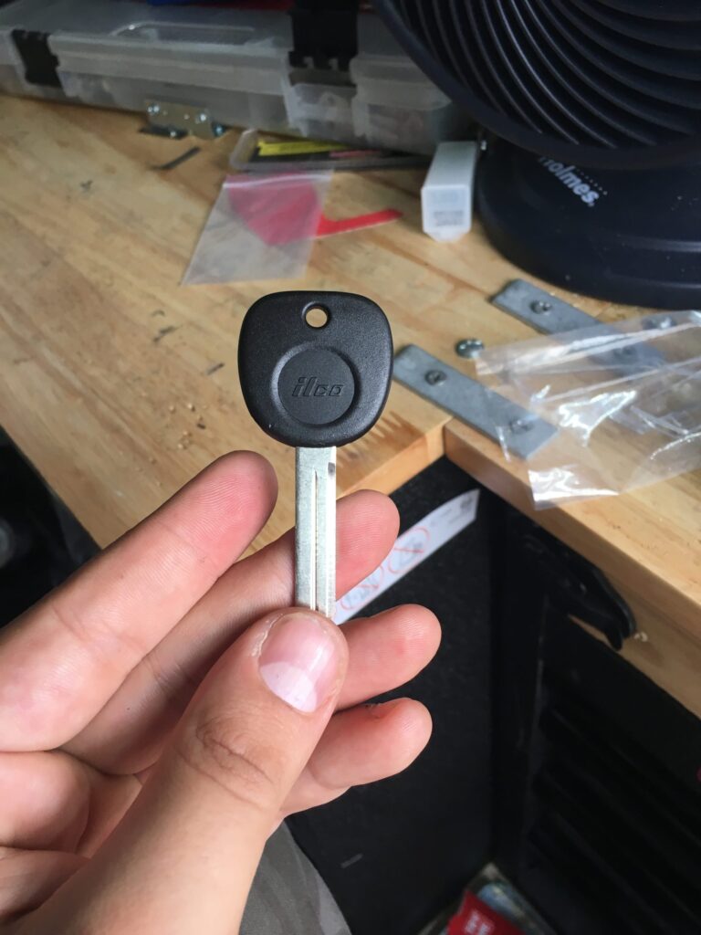 hand holding automotive car key replacement duplicate