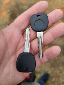 hand holding 2 car keys cut and program