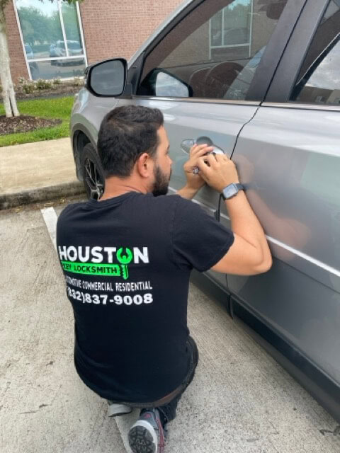 "Emergency locksmith unlocking car door in Midtown Houston – Houston Key Locksmith"
