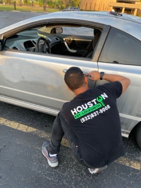 Locksmith Katy – Houston Key Locksmith technician installing or repairing a door lock