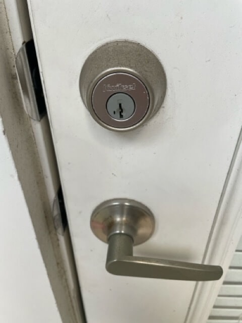 Residential locksmith installing digital lock in West University Place – Houston Key Locksmith